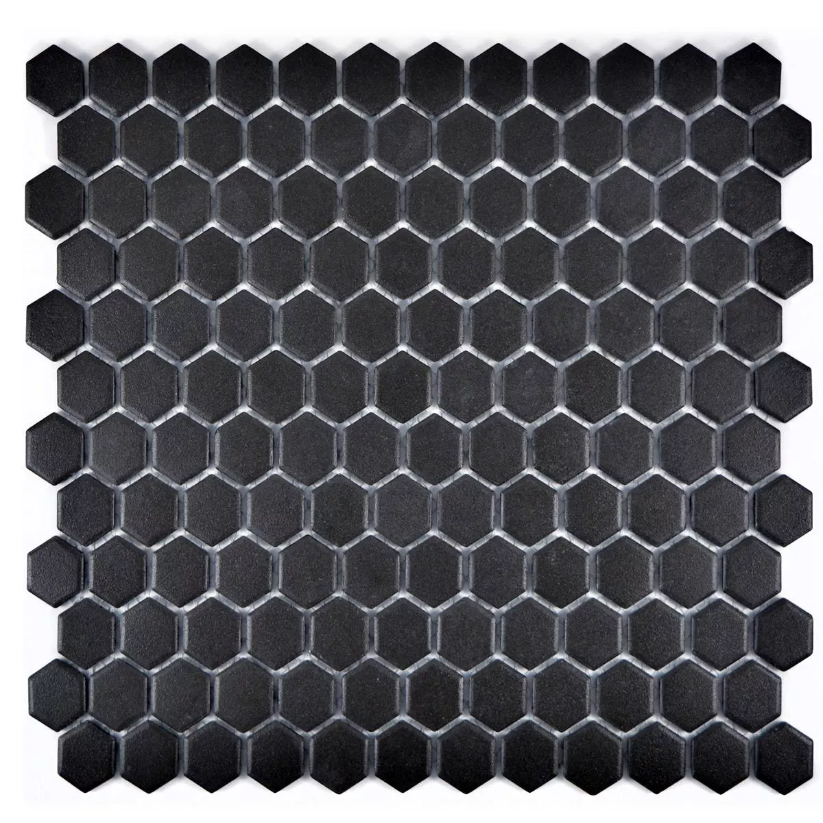 Muster von Keramik Mosaikfliesen Hexagon Zeinal Unglasiert Schwarz R10B